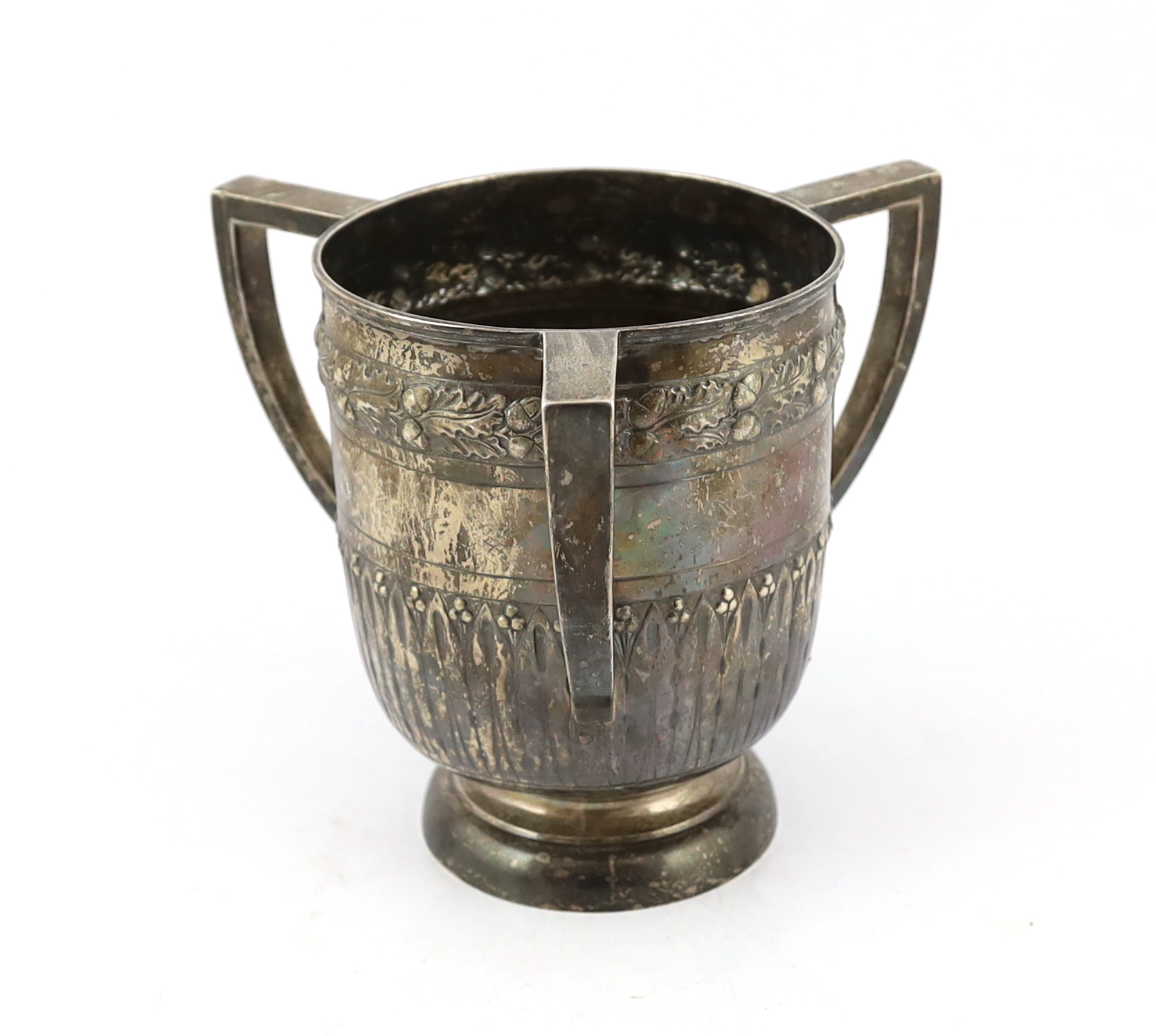 A late Victorian embossed silver presentation tyg, by John Newton Mappin